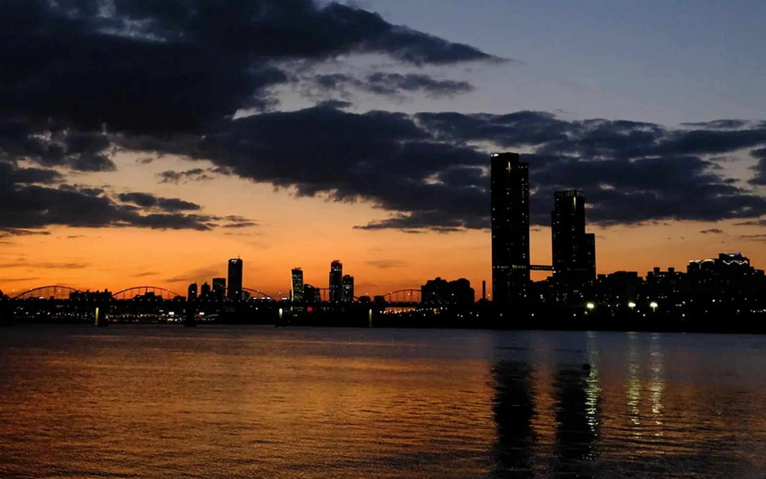 River, city and dawn